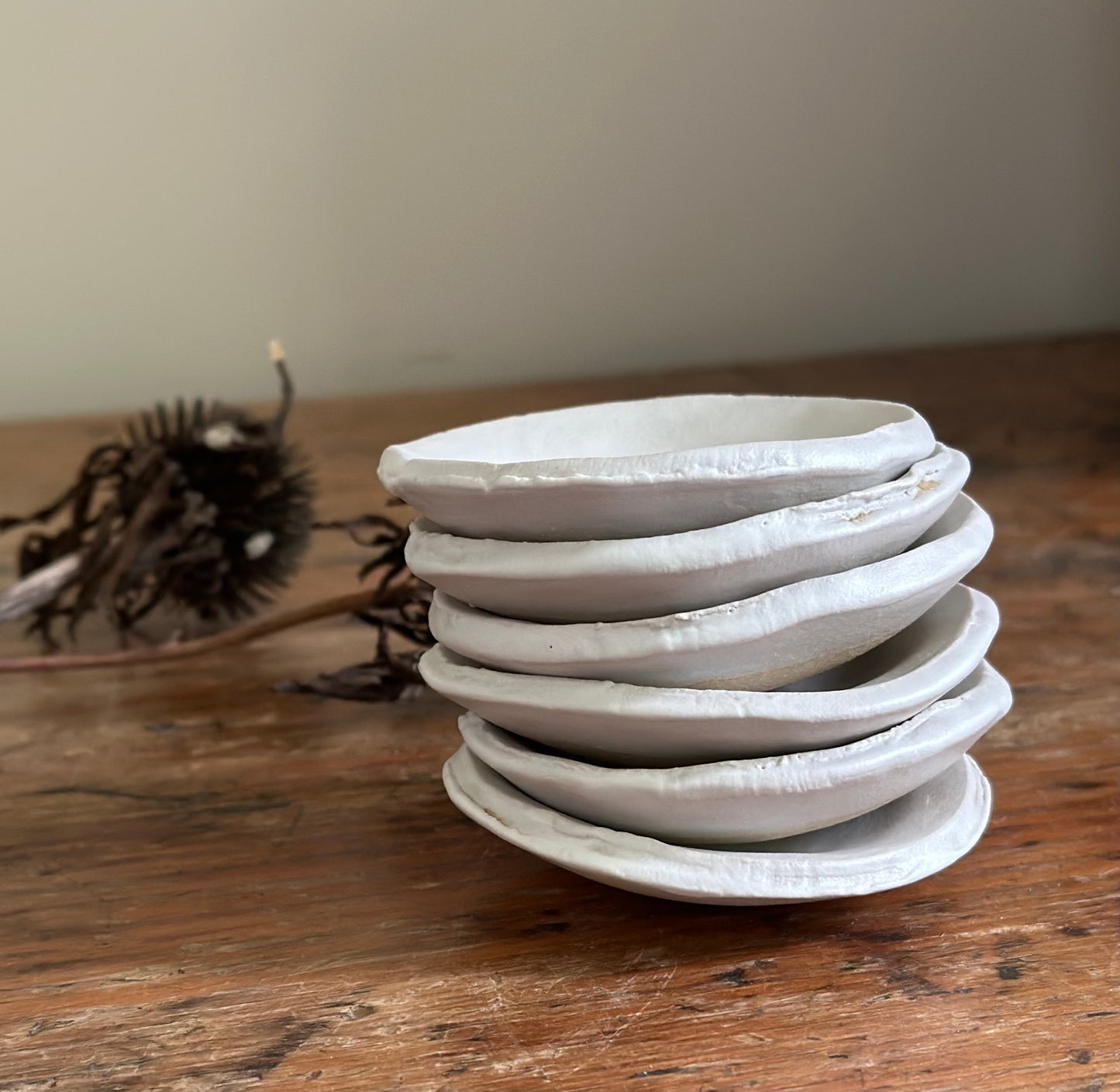 Stck of six handmade pottery tiny matte white bowls.